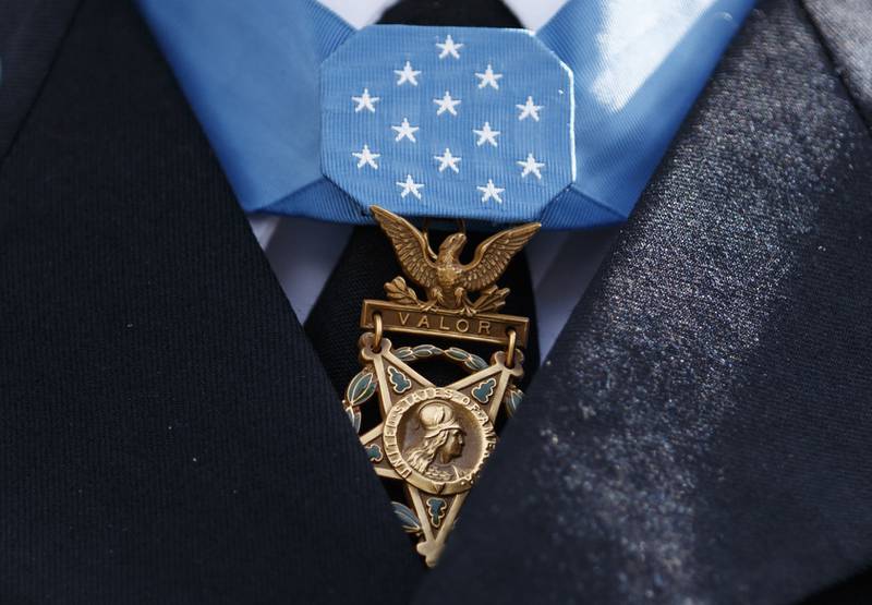 The Medal of Honor is seen around the neck of Medal of Honor recipient Army Staff Sgt. David Bellavia outside the West Wing of the White House in Washington, June 25, 2019.