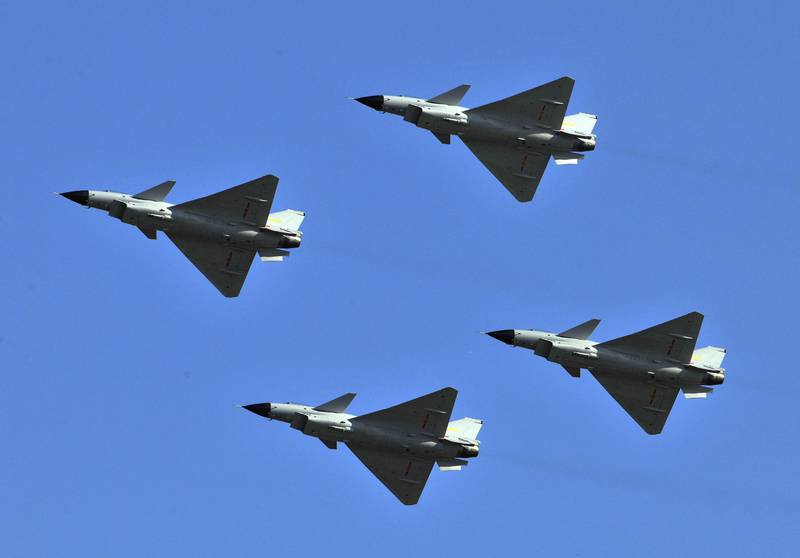 J-10 jet fighters perform in formation to celebrate the 60th anniversary of the People's Liberation Army Air Force in Beijing, China, Nov. 15, 2009.