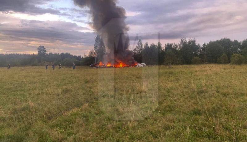 This image released by Ostorozhno Novosti on Wednesday, Aug. 23, 2023, shows the crash site of a private jet near the village of Kuzhenkino, Tver Region.
